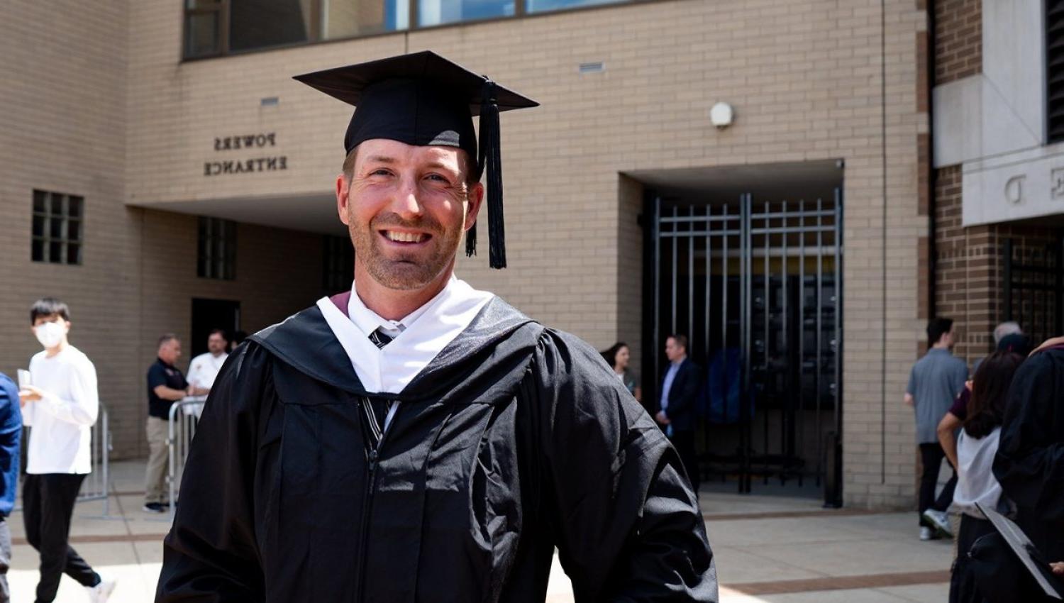 Brooks Orpik wearing a graduation cap and gown