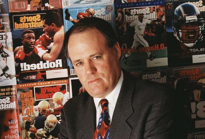 Mulvoy as photographed in front of a wall of Sports Illustrated magazine covers